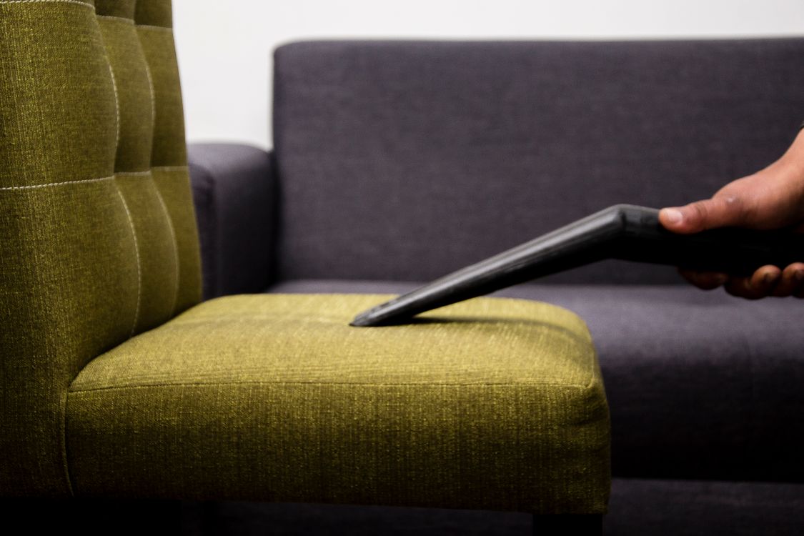 Professional cleaner vacuuming an office — cleaner CV format for Dubai