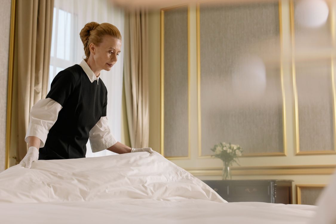 Hotel housekeeper at work — cleaner CV format for Dubai